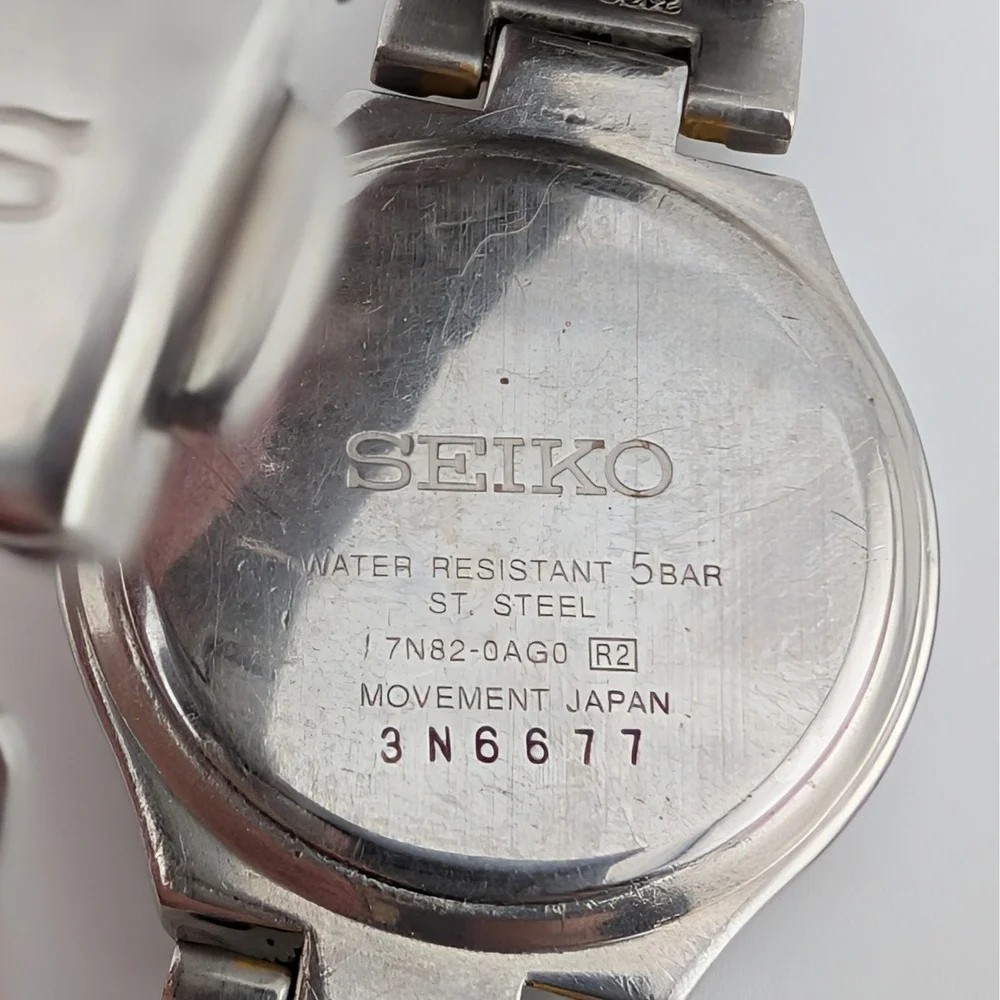 Seiko 7N82-0AG0 Blue Sunburst Two Tone Date Quartz Watch 50M‎